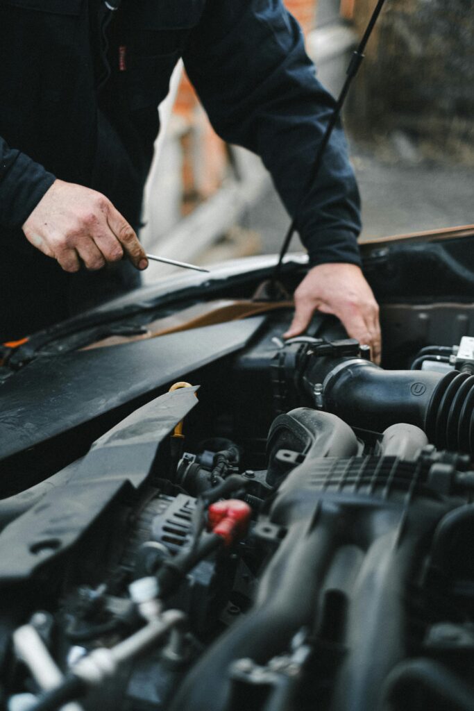 Close-up of a car engine showing components related to check engine light issues.