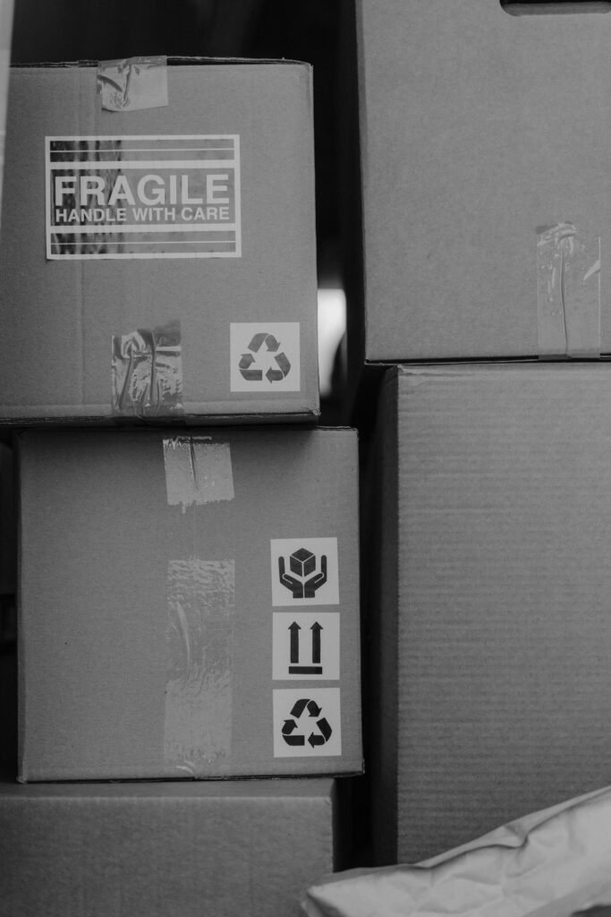 Household items are being packed into boxes during a home relocation.